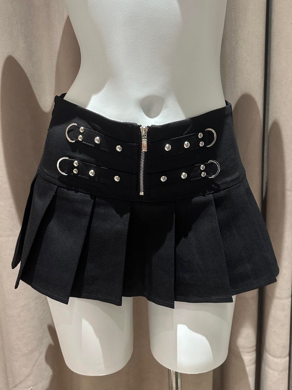 Black Pleated Mini Skirt with Decorative Buckles